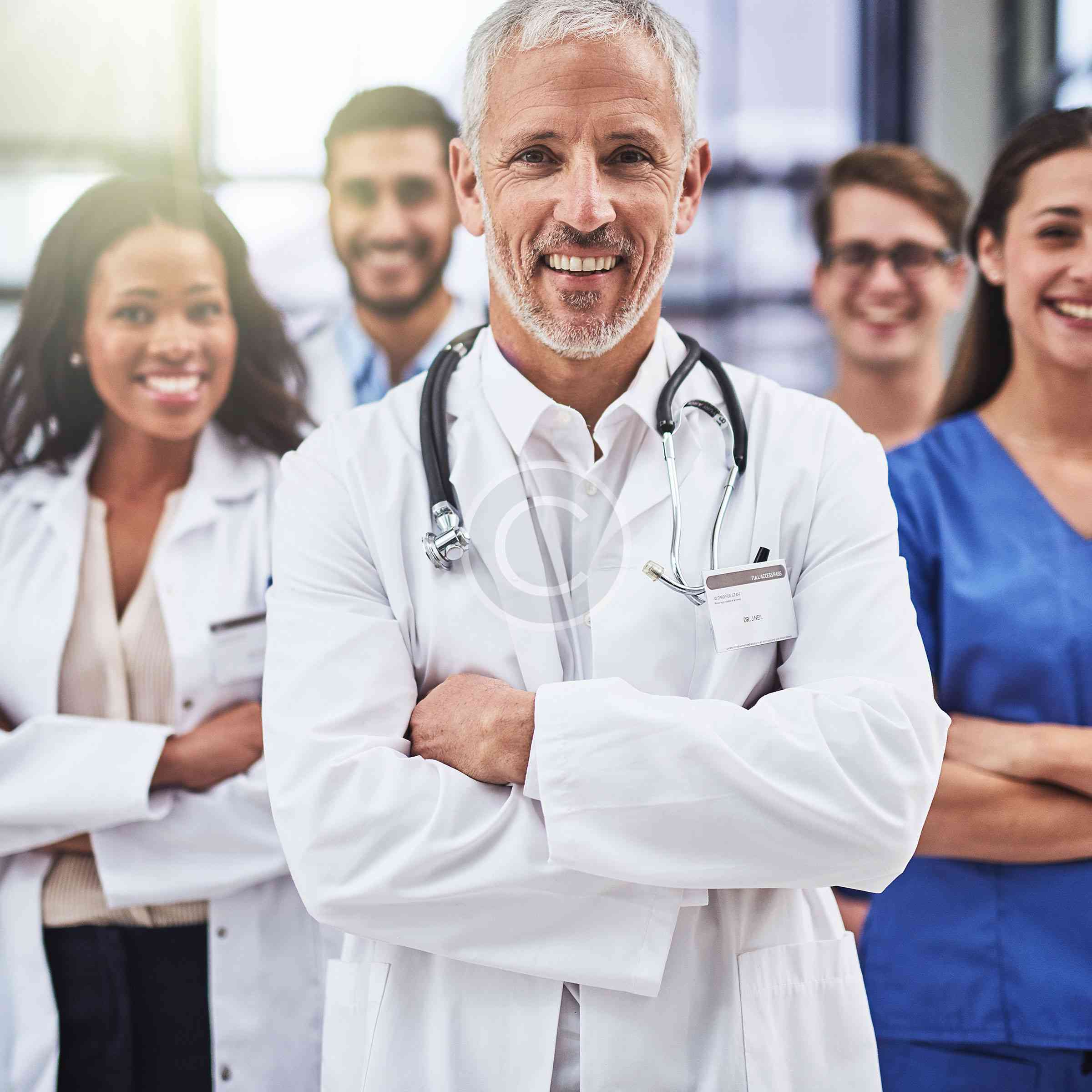 Medical team smiling in a healthcare setting.