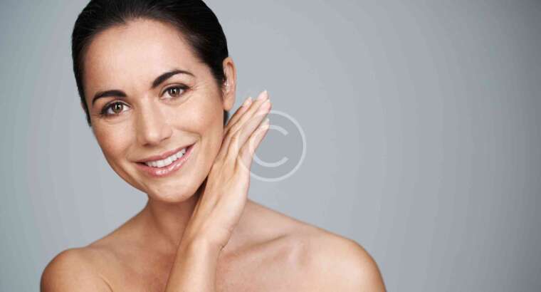Smiling woman with a natural, radiant look.